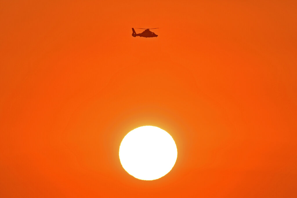 A file photo taken on Sept. 2, 2020 shows a helicopter above the sun. (Jose Carlos Fajardo/Bay Area News Group via AP)