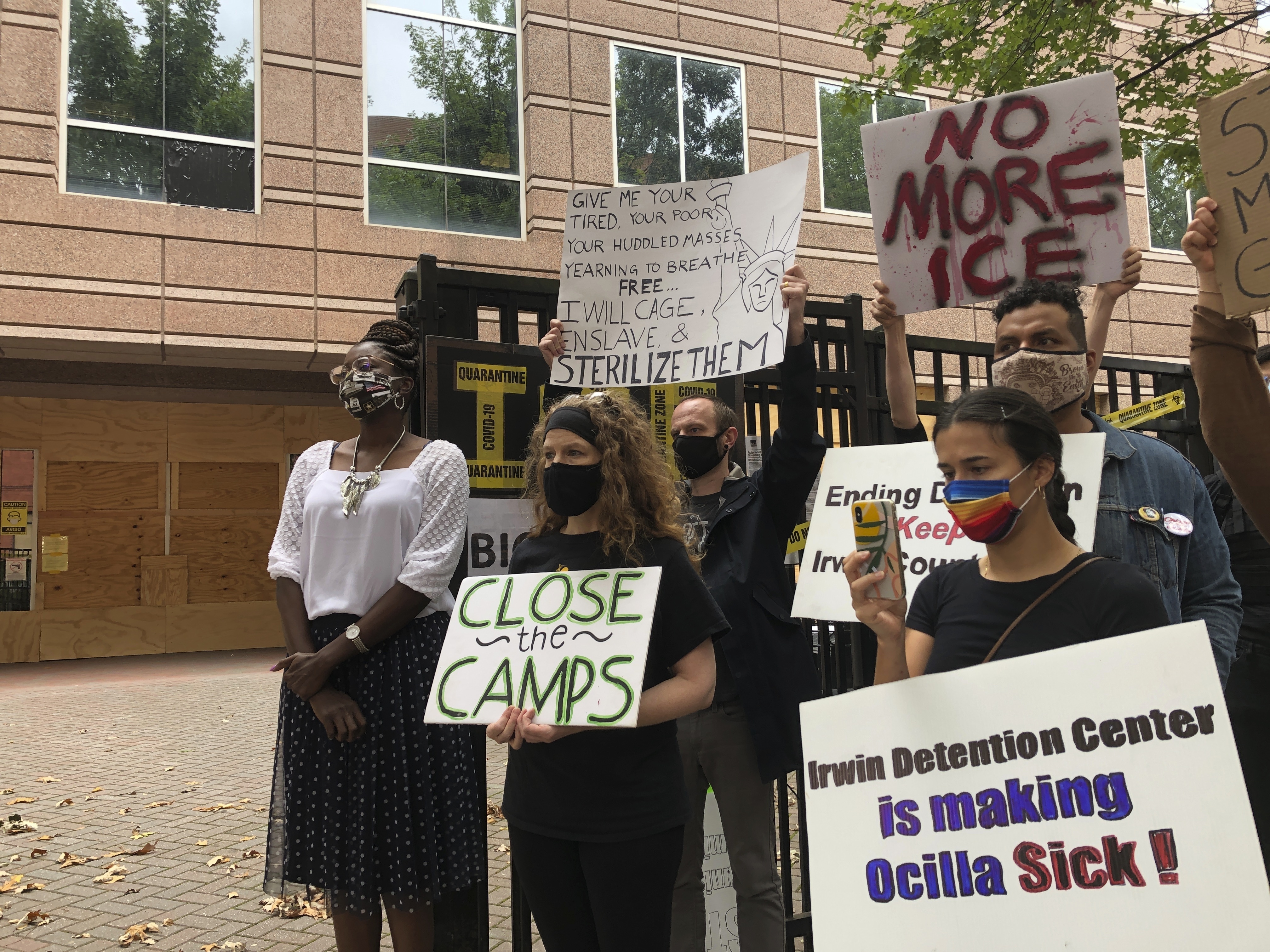 Dawn Wooten, left, a nurse at Irwin County Detention Center in Ocilla, Georgia, speaks at a Sept. 15, 2020 news conference in Atlanta protesting conditions at the immigration jail. (Jeff Amy / Associated Press)