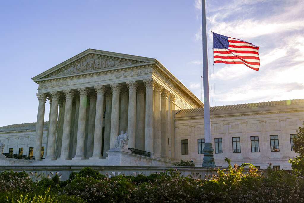 The flag flies at half-staff at the Supreme Court on the morning after the death of Justice Ruth Bader Ginsburg, 87, Saturday, Sept. 19, 2020 in Washington. (AP Photo/J. Scott Applewhite)