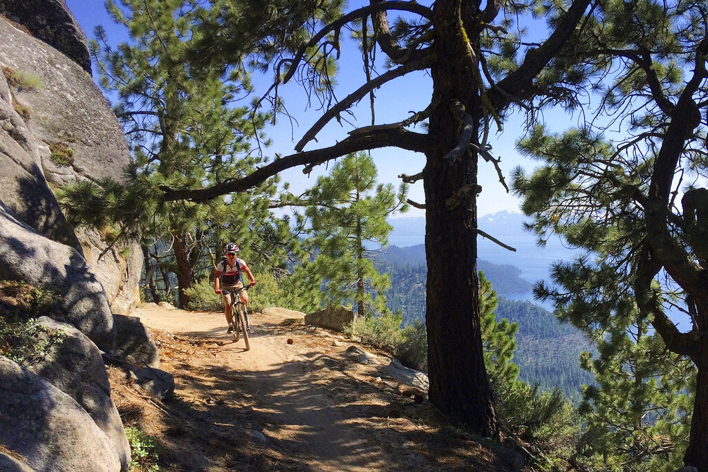 A bicyclist rides down the Flume Trail near Incline Village, Nev., on July 22, 2017. (AP Photo/Brian Melley)