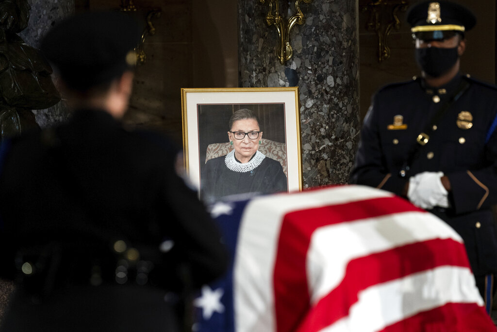 The flag-draped casket of Justice Ruth Bader Ginsburg lies in state in the U.S. Capitol on Friday, Sept. 25, 2020. (Erin Schaff/The New York Times via AP, Pool)