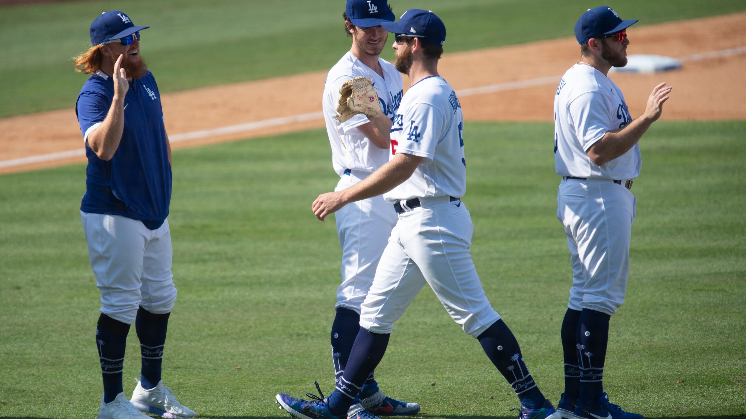 The Los Angeles Dodgers celebrate a 5-0 win over the Los Angeles Angels in a baseball game in Los Angeles, Sunday, Sept. 27, 2020. (AP Photo/Kyusung Gong)