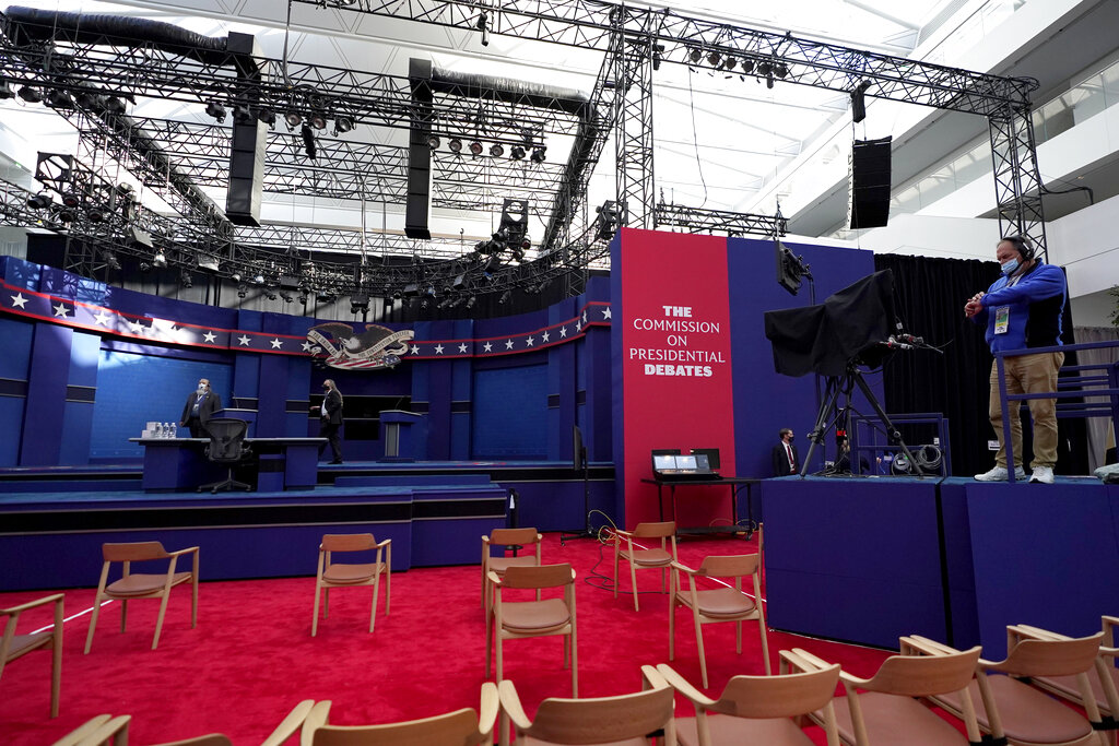 A camera operator checks his watch ahead of the first presidential debate between Republican candidate President Donald Trump and Democratic candidate former Vice President Joe Biden at the Health Education Campus of Case Western Reserve University, Tuesday, Sept. 29, 2020, in Cleveland. (AP Photo/Julio Cortez)