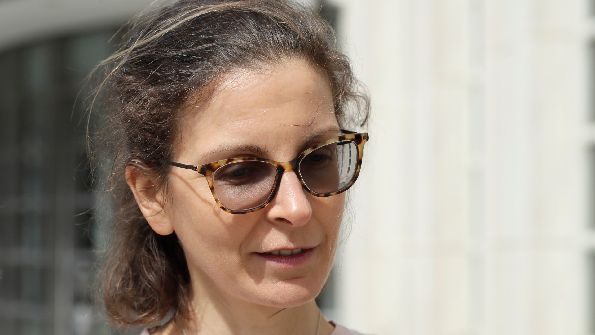 In this April 8, 2019, file photo, Seagram's liquor fortune heiress Clare Bronfman leaves Brooklyn Federal Court, in New York. Bronfman, the wealthy benefactor of Keith Raniere, the disgraced leader of a self-improvement group in upstate New York convicted of turning women into sex slaves branded with his initials, will be in court, on Wednesday, Sept. 30, 2020, for sentencing on federal conspiracy charges. (AP Photo/Mark Lennihan, File)