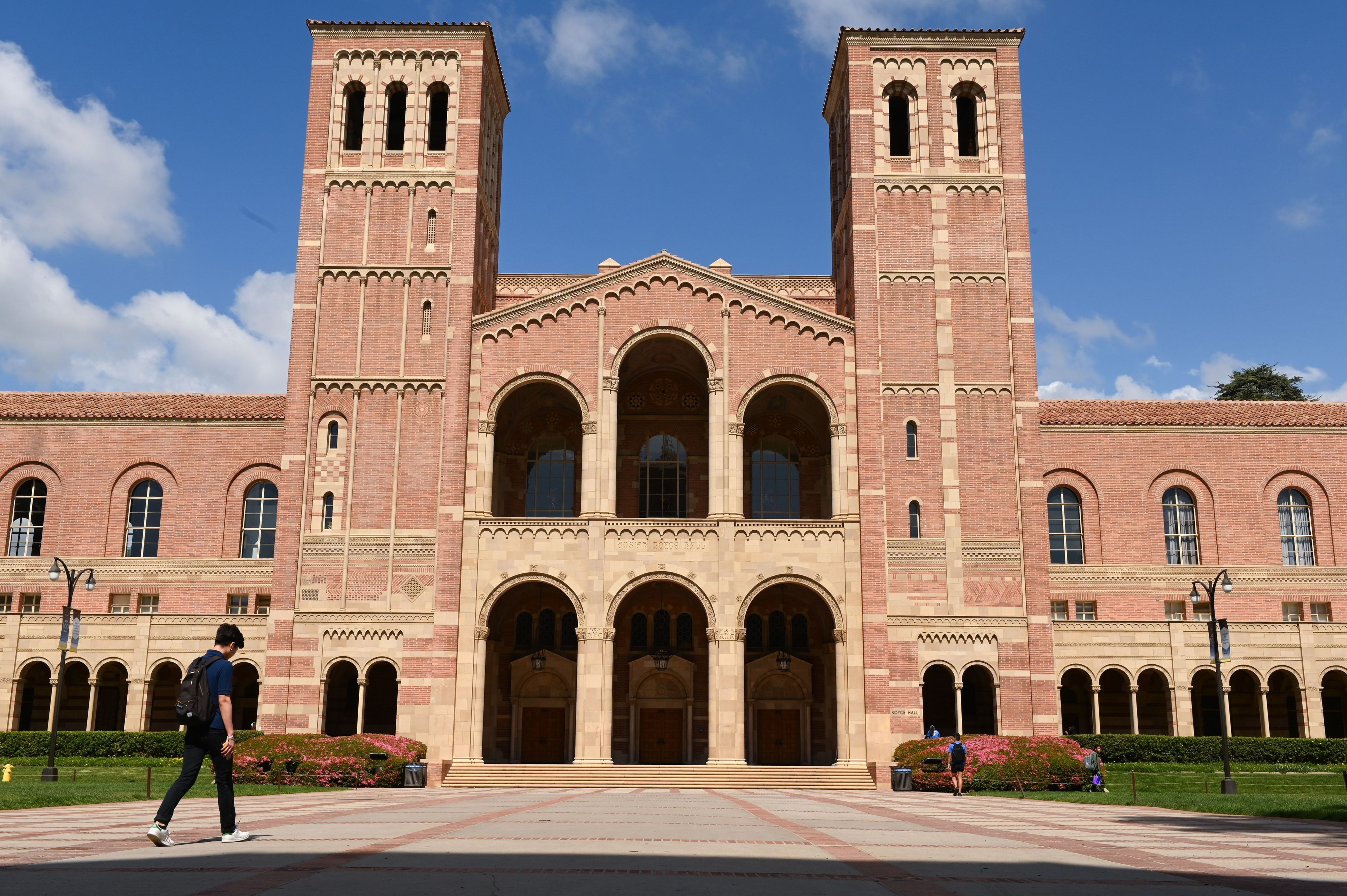 A student walks toward Royce Hall on the campus of UCLA on March 11, 2020. (ROBYN BECK/AFP via Getty Images)