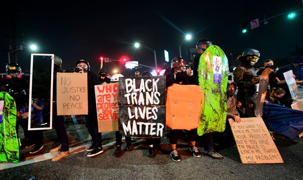 People hold placards and shields as they prepare before being dispersed by sheriff's deputies outside the South L.A. sheriff's station to protest again in the wake of Dijon Kizzee's killing, on Sept. 8, 2020 in Los Angeles, California. (FREDERIC J. BROWN/AFP via Getty Images)