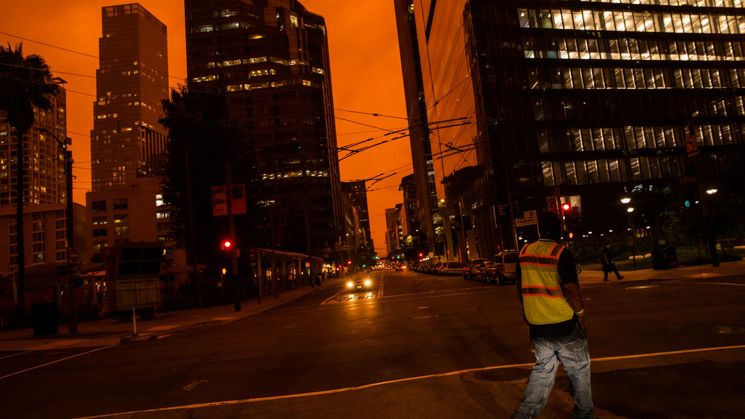 An orange glow is seen over a darkened Howard Street as smoke from various wildfires burning across Northern California mixes with the marine layer on Sept. 9, 2020, in San Francisco. (Philip Pacheco/Getty Images)