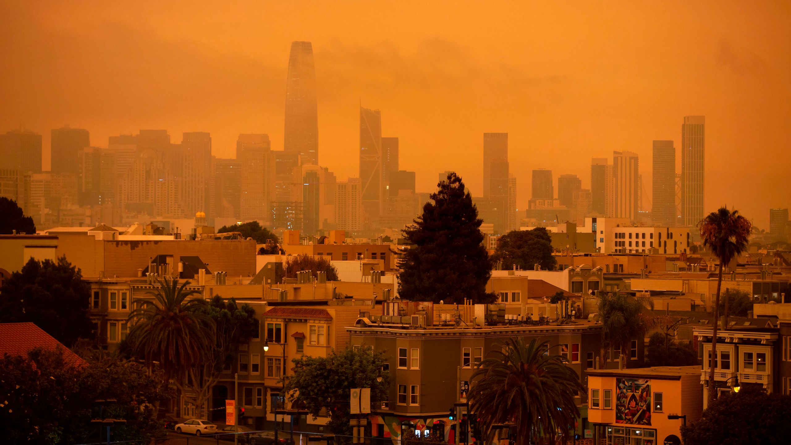 A hazy San Francisco skyline is seen from Dolores Park in San Francisco, California on Sept. 9, 2020. - More than 300,000 acres were burning across the state including 35 major wildfires, with at least five towns "substantially destroyed" and mass evacuations taking place. (Brittany Hosea-Small / AFP via Getty Images)