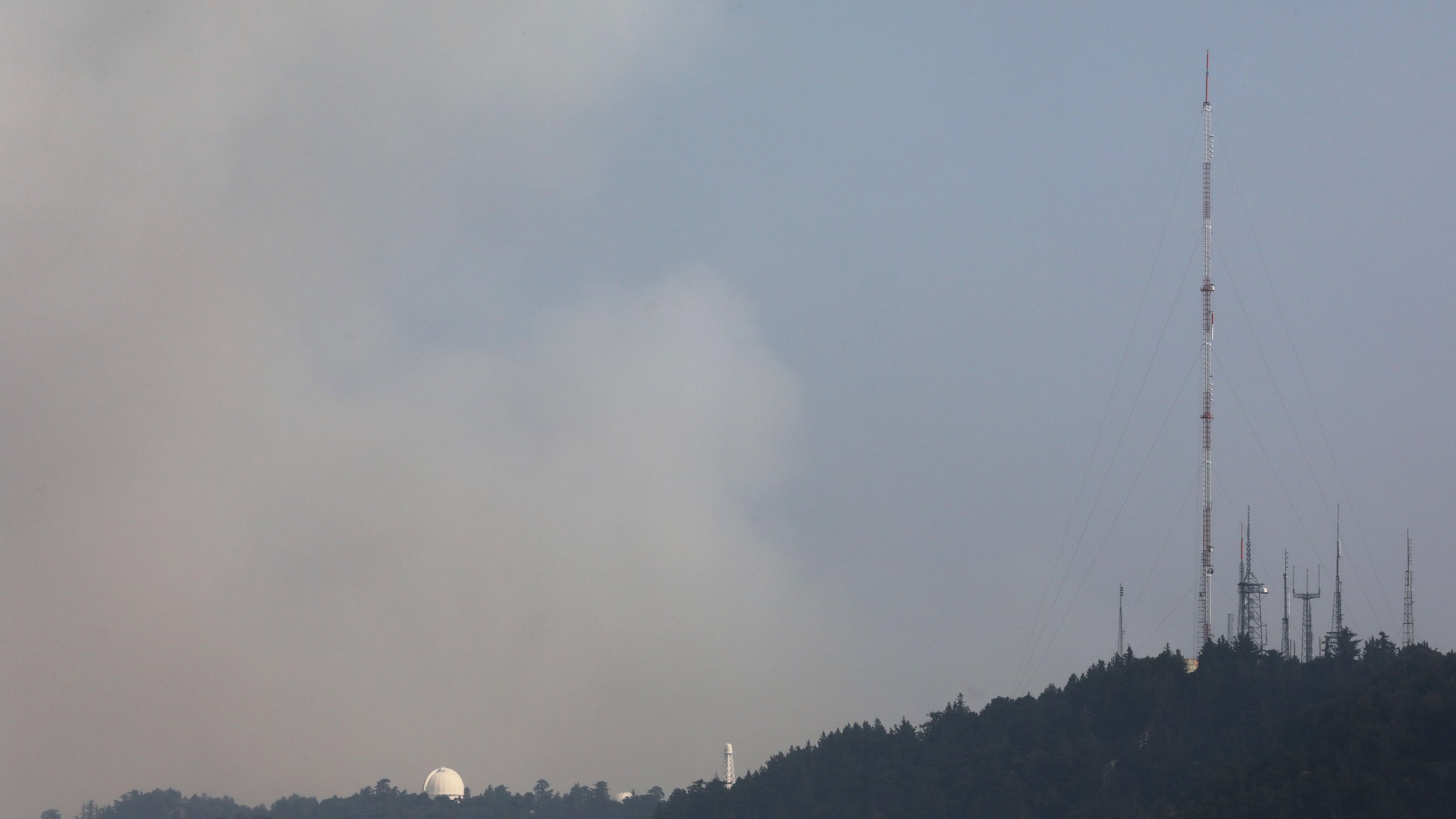 Smoke rises behind the Mount Wilson Observatory as the Bobcat Fire burns in the Angeles National Forest on Sept. 14, 2020, near Pasadena. (Mario Tama/Getty Images)