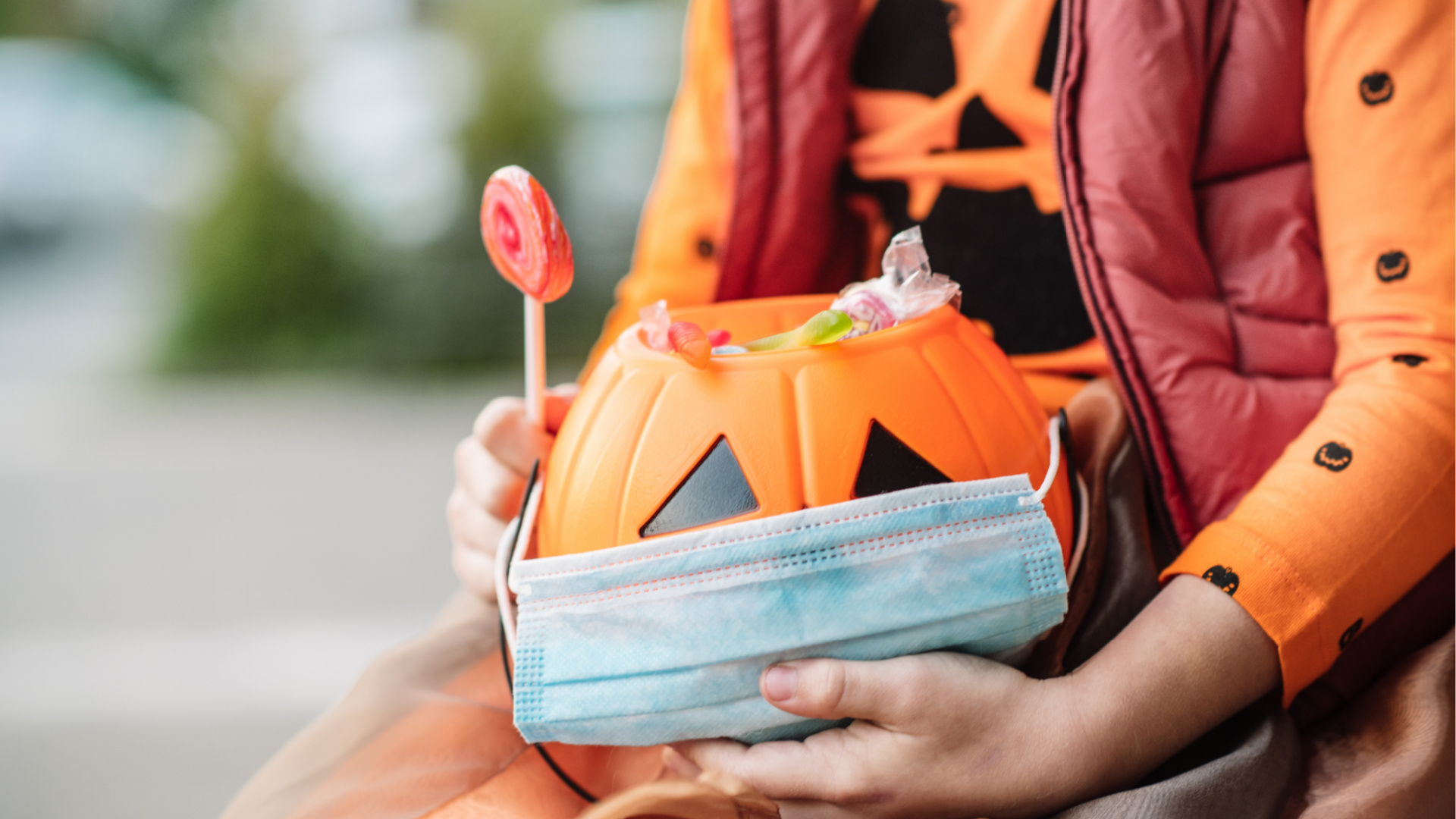 Halloween Pumpkin Jack O' Lantern Candy Bucket is covered with a face mask in this file photo. (Getty Images)