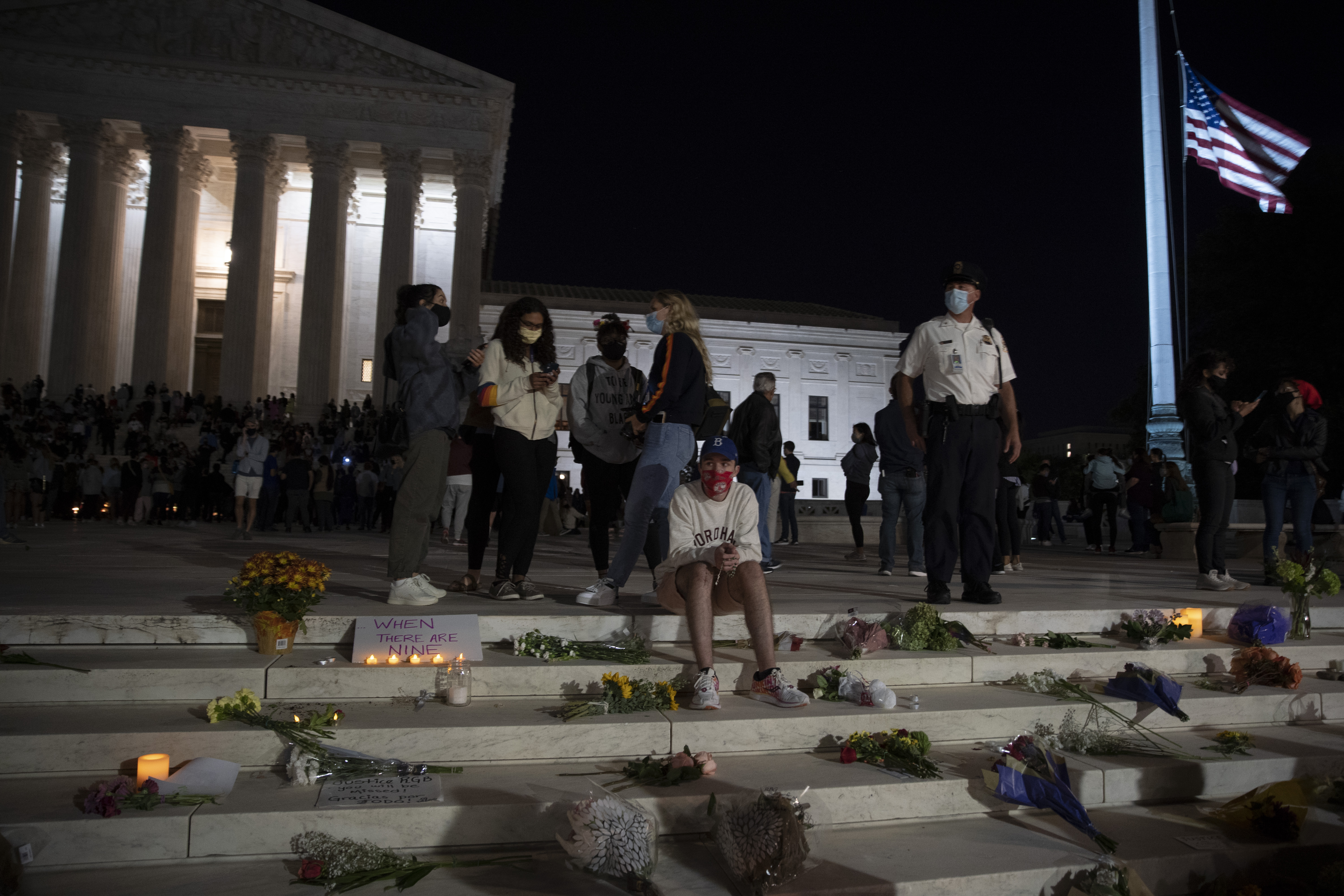 The national flag flies at half staff as people gather to mourn the passing of Supreme Court Justice Ruth Bader Ginsburg at the steps in front of the Supreme Court on Sept. 18, 2020 in Washington, D.C. (Tasos Katopodis/Getty Images)