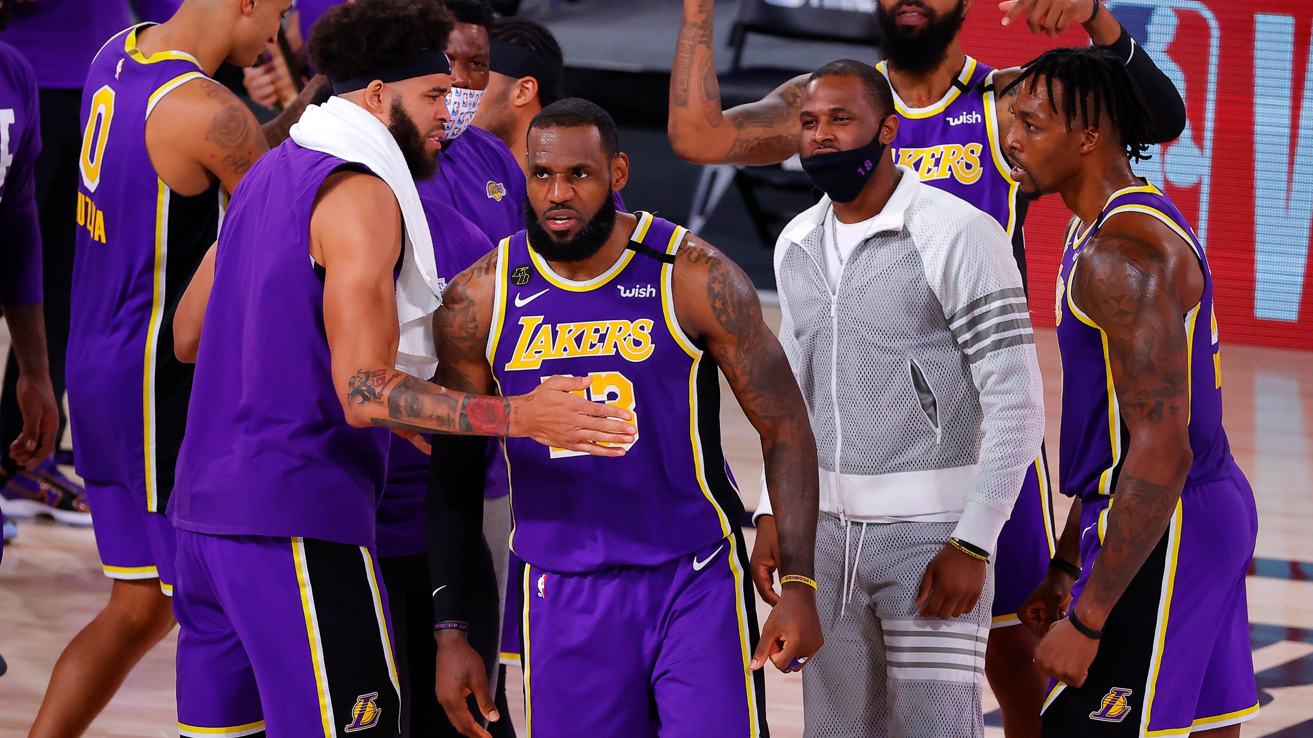 LeBron James #23 of the Los Angeles Lakers celebrates with teammates after their win against the Denver Nuggets in Game Five of the Western Conference Finals during the 2020 NBA Playoffs at AdventHealth Arena at the ESPN Wide World Of Sports Complex on Sept. 26, 2020 in Lake Buena Vista, Florida. (Kevin C. Cox/Getty Images)