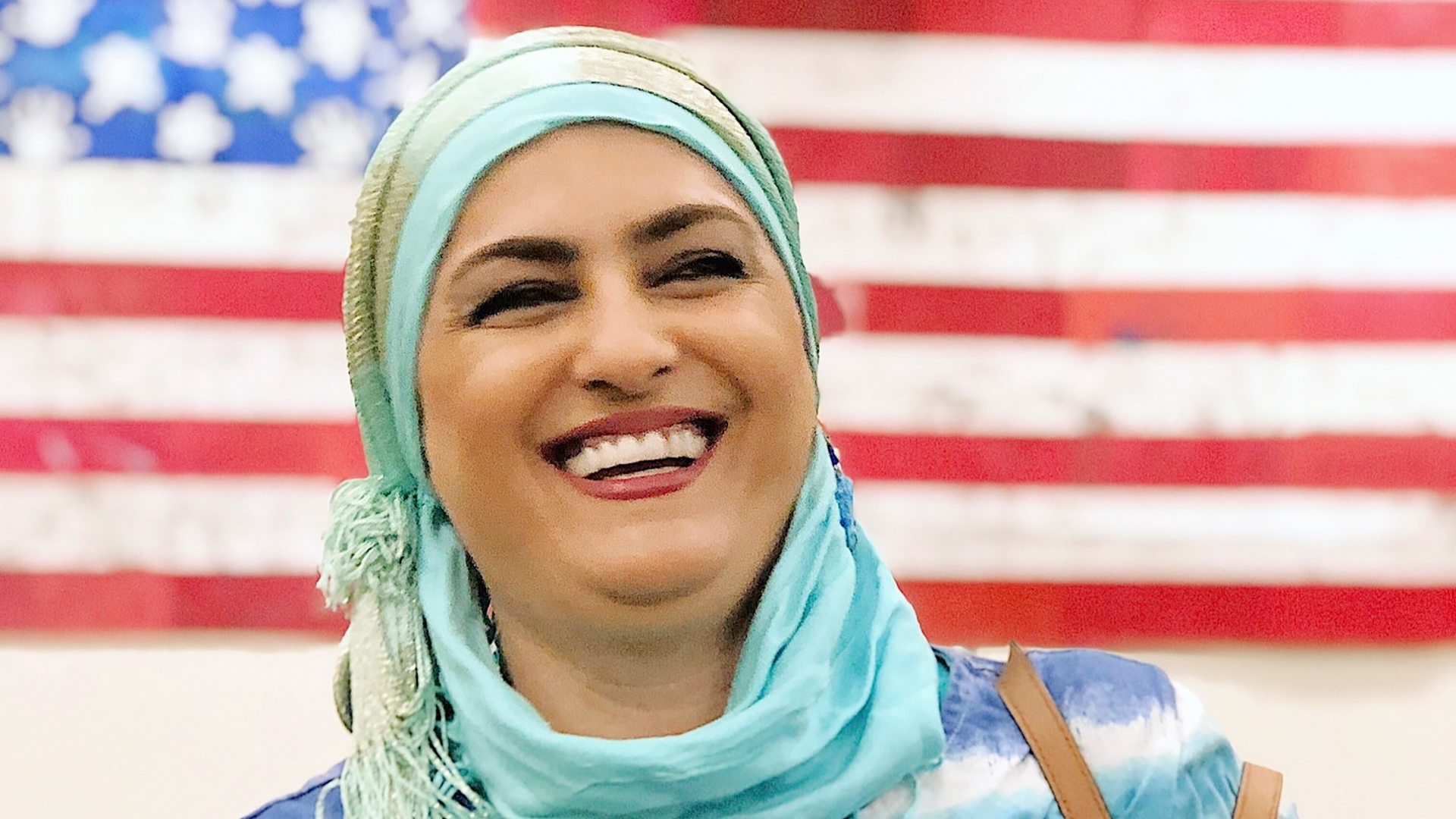 This September 2019 provided by Danielle Luna shows Iraqi born refugee Nada Al Rubaye at her naturalization ceremony in Phoenix.