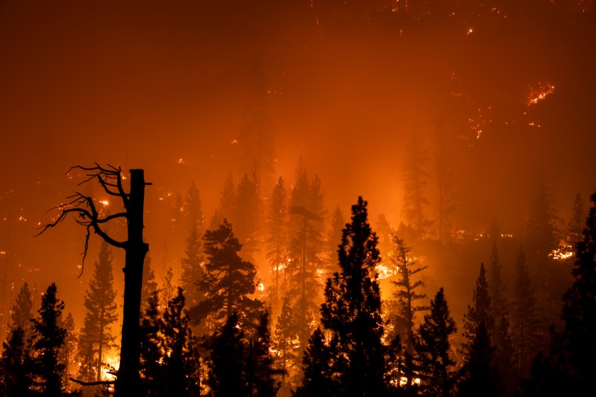 The Creek fire burns along Huntington Lake Road as it approaches the Southern California Edison Big Creek Hydroelectric Plant on Sunday in Big Creek, Calif.(Kent Nishimura/Los Angeles Times)