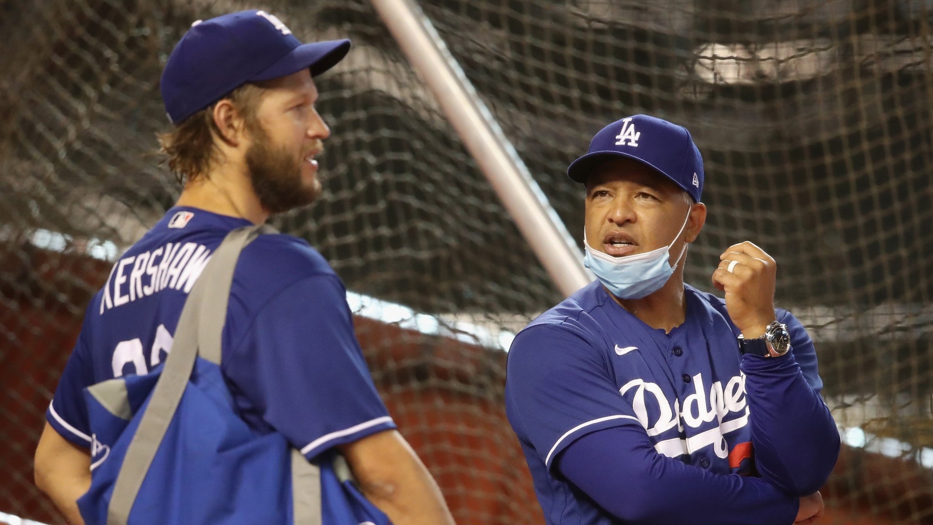 Manager Dave Roberts of the Los Angeles Dodgers talks with pitcher Clayton Kershaw before the MLB game against the Arizona Diamondbacks at Chase Field on July 30, 2020 in Phoenix, Arizona. (Photo by Christian Petersen/Getty Images)