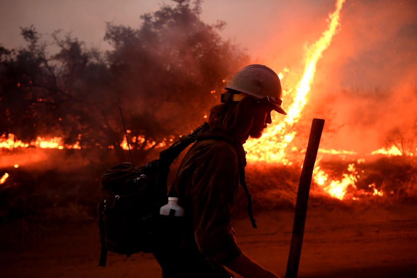 A firefighter helps to set back fires as the El Dorado fire approaches in Yucaipa on Sept. 7 2020. (Wally Skalij / Los Angeles Times)