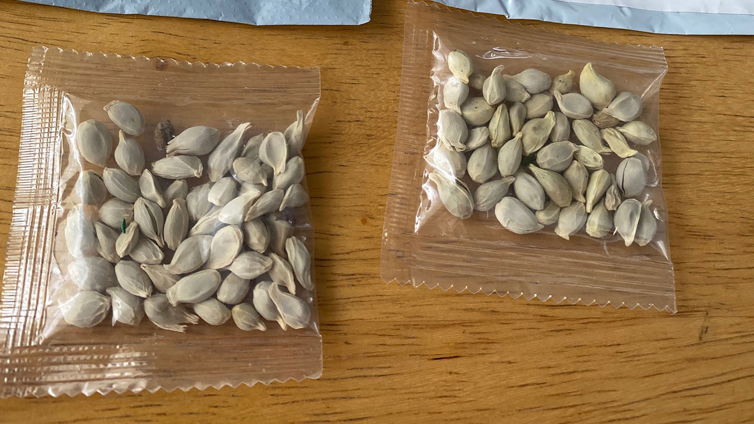 In this photo posted on Facebook by the Washington State Department of Agriculture, packages of unidentified seeds sent to the U.S. from China are seen.