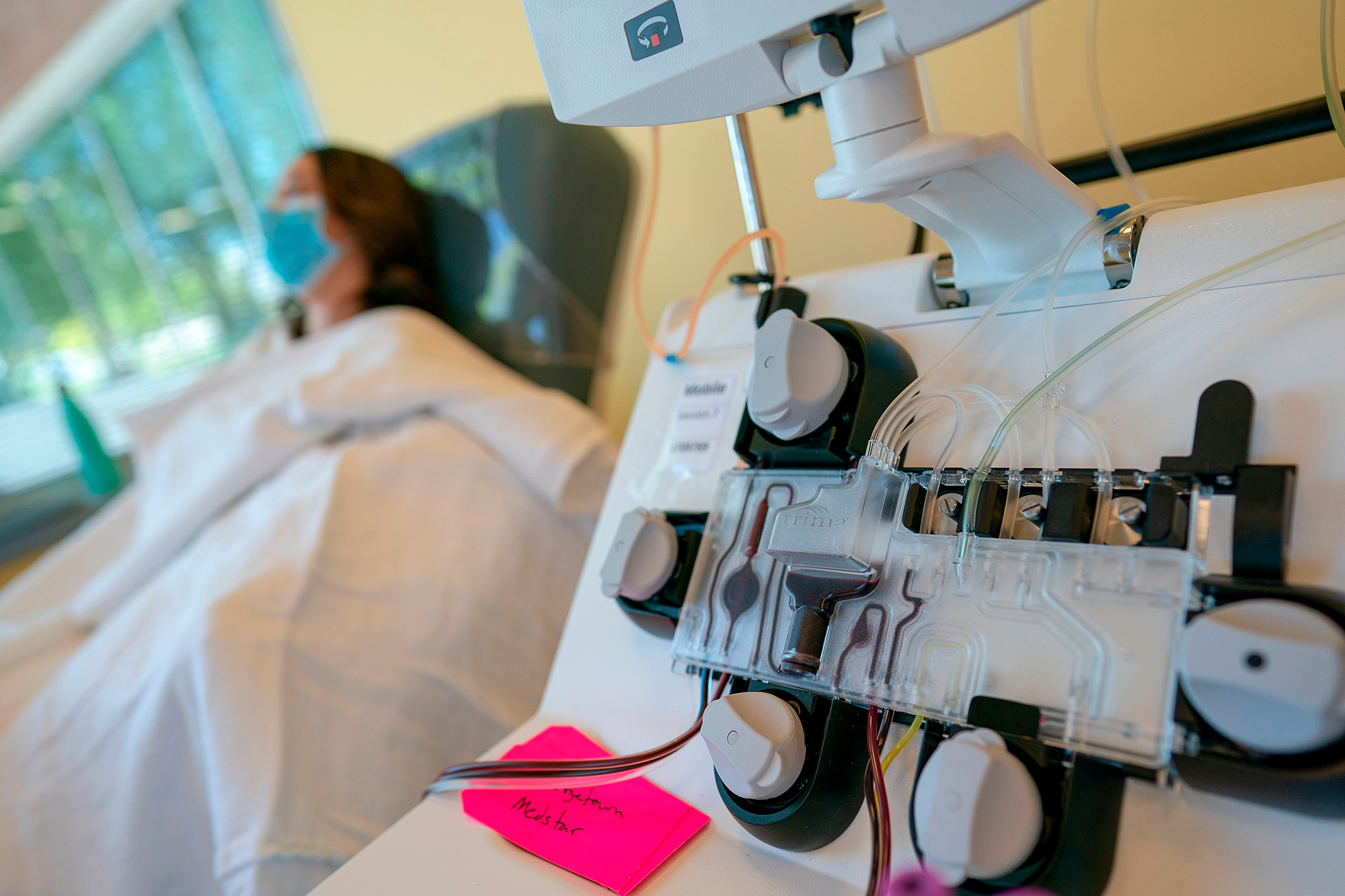 Mckinley Edelman, 26, a recovered COVID-19 patient, donates plasma to MedStar Georgetown University Hospital at Inova Blood Services on April 22, 2020 in Dulles, Virginia. (Alex Edelman / AFP via Getty Images)