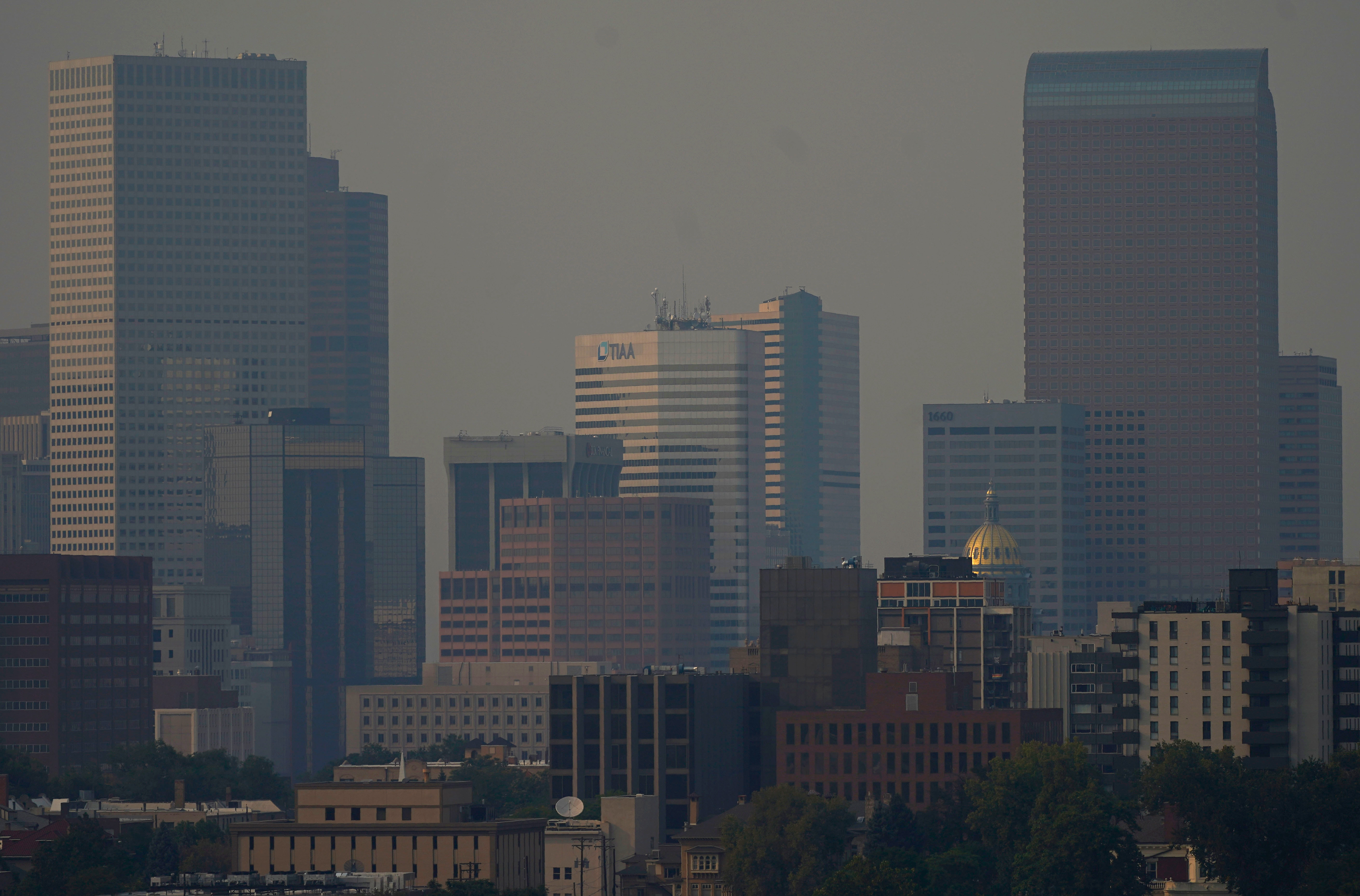 Denver residents will go from experiencing record heat to preparing for a sudden snow storm. (David Zalubowski/AP via CNN Wire)