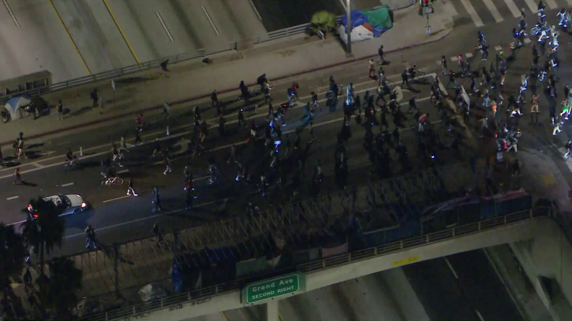 Protesters march across a freeway overpass in downtown Los Angeles on Sept. 23, 2020, following a grand jury’s decision not to charge Louisville police officers directly in Breonna Taylor’s death. (KTLA)