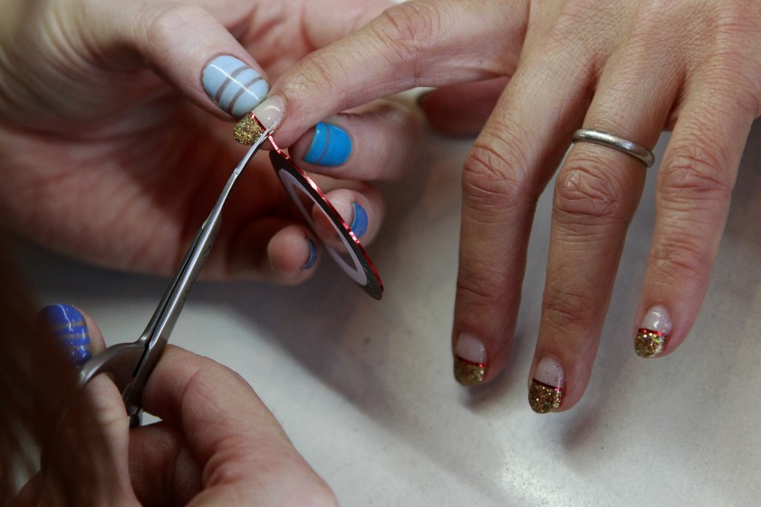 A nail technician works on a customer's nails in this undated file photo. (Kirk McKoy / Los Angeles Times)