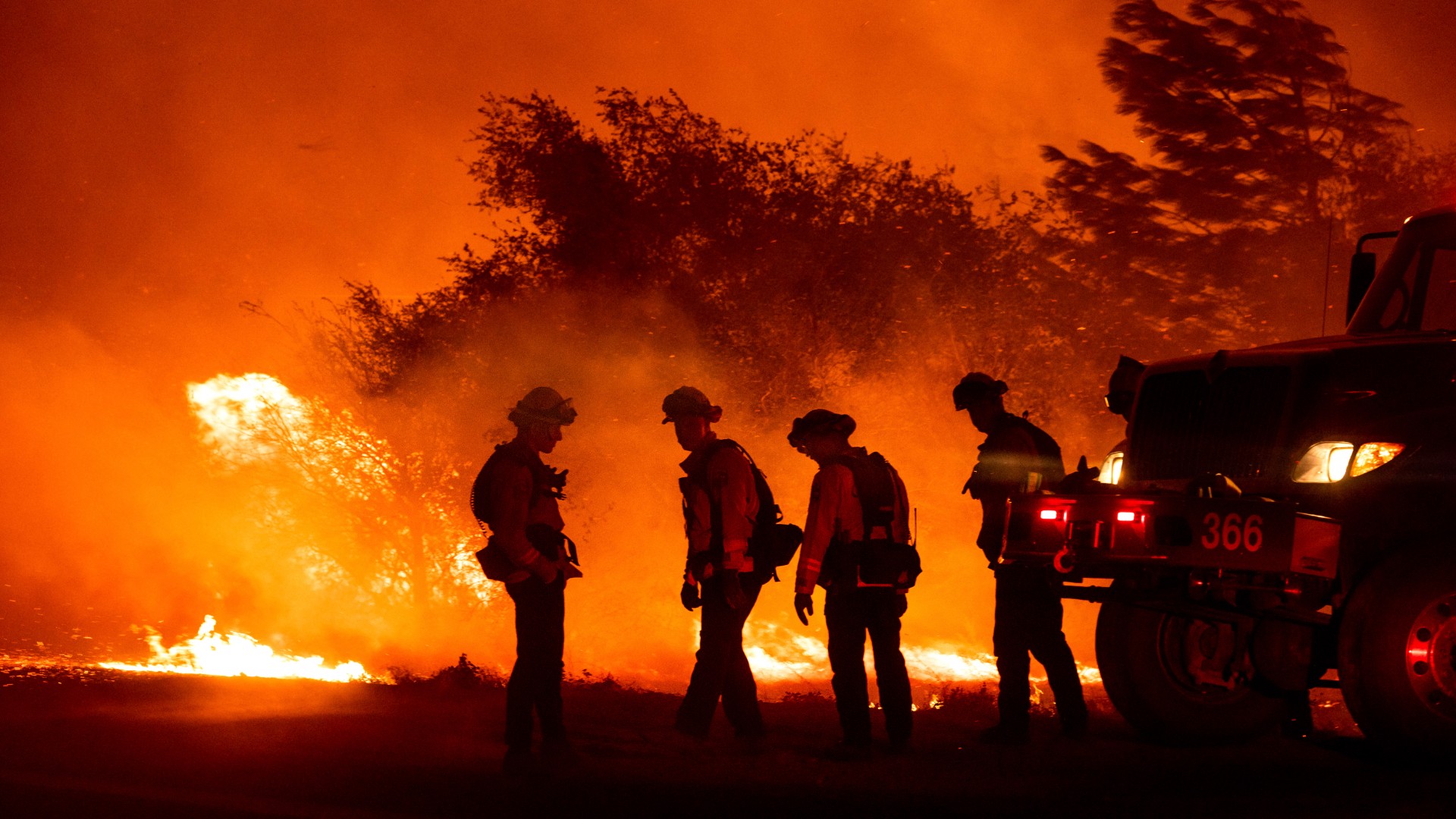 Firefighters monitor the Bear Fire burning in Oroville, Calif., on Wednesday, Sept. 9, 2020. The blaze, part of the lightning-sparked North Complex, expanded at a critical rate of spread as winds buffeted the region. (AP Photo/Noah Berger)