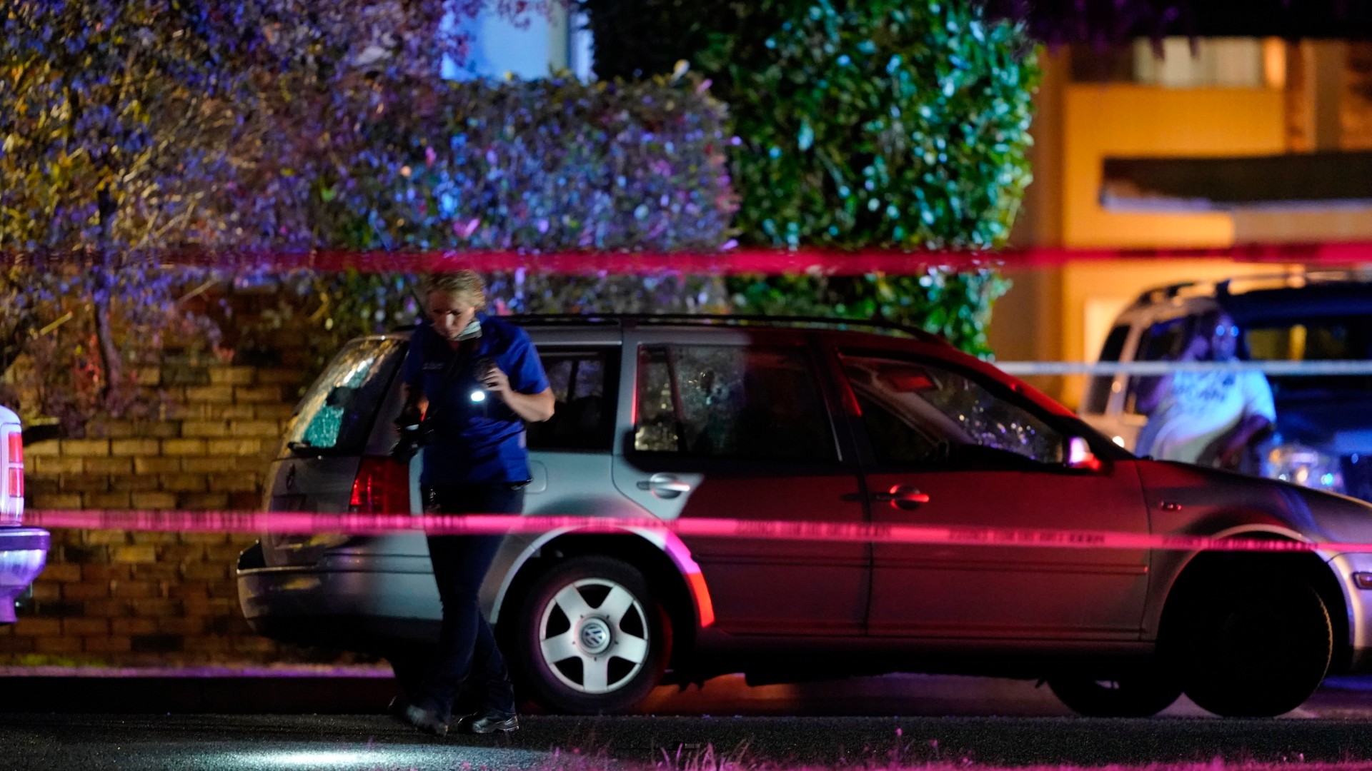 An investigator works at a scene where a man suspected of fatally shooting a supporter of a right-wing group in Portland, Ore., last week was killed as investigators moved in to arrest him in Lacey, Wash., Thursday, Sept. 3, 2020. (AP Photo/Ted Warren)