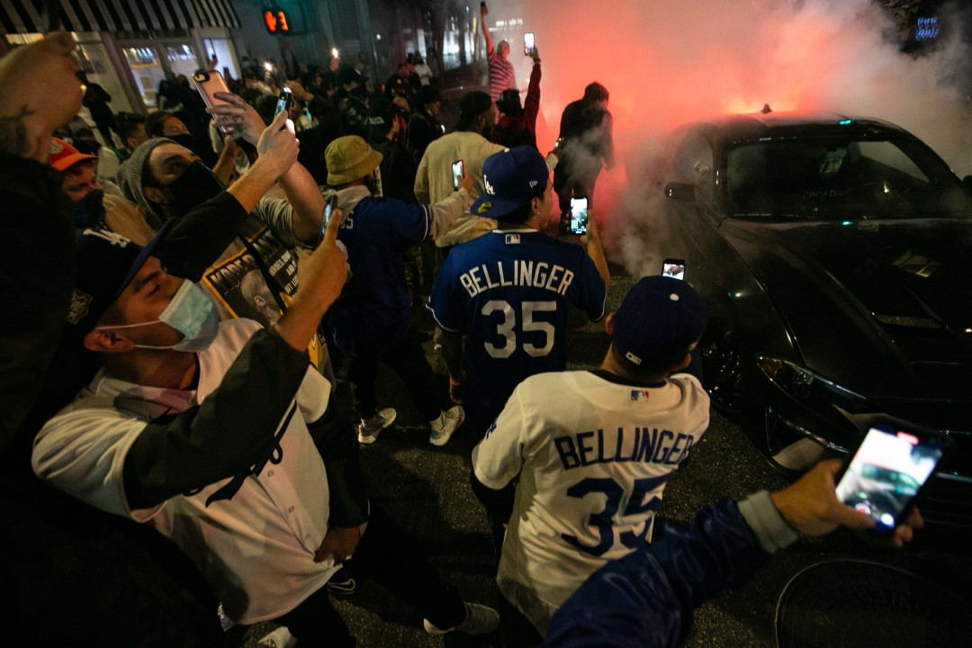 Fans gather in downtown Los Angeles on Oct. 27, 2020 to celebrate the Los Angeles Dodgers win over the Tampa Bay Rays in Game 6 to win the World Series.(Jason Armond / Los Angeles Times)