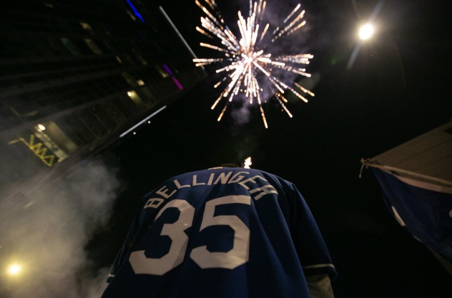 Fireworks light up the sky in downtown Los Angeles as fans celebrate after the Los Angeles Dodgers defeated the Tampa Bay Rays in Game 6 to win the World Series on Oct. 27, 2020. (Jason Armond / Los Angeles Times)