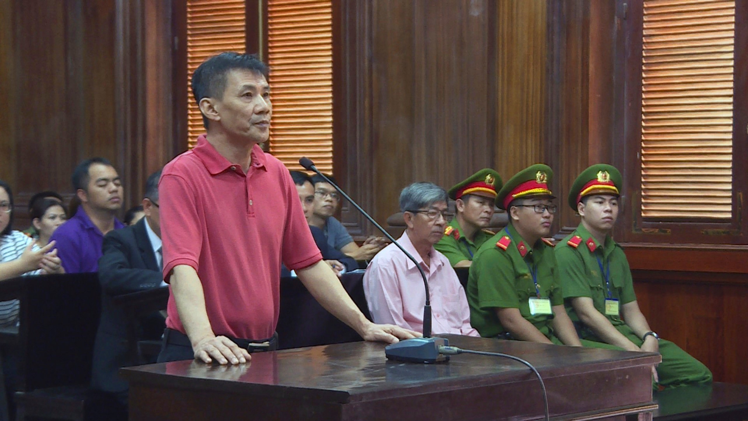 Michael Nguyen stands during his trial in Ho Chin Minh City, Vietnam, on June 24, 2019. (Nguyen Thanh Chung/Vietnam News Agency via Associated Press)