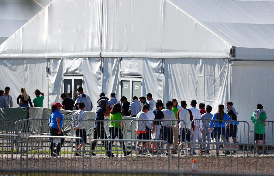 Children line up to enter a tent at the Homestead Temporary Shelter for Unaccompanied Children in Homestead, Florida, on Feb. 19, 2019. (Wilfredo Lee / Associated Press)