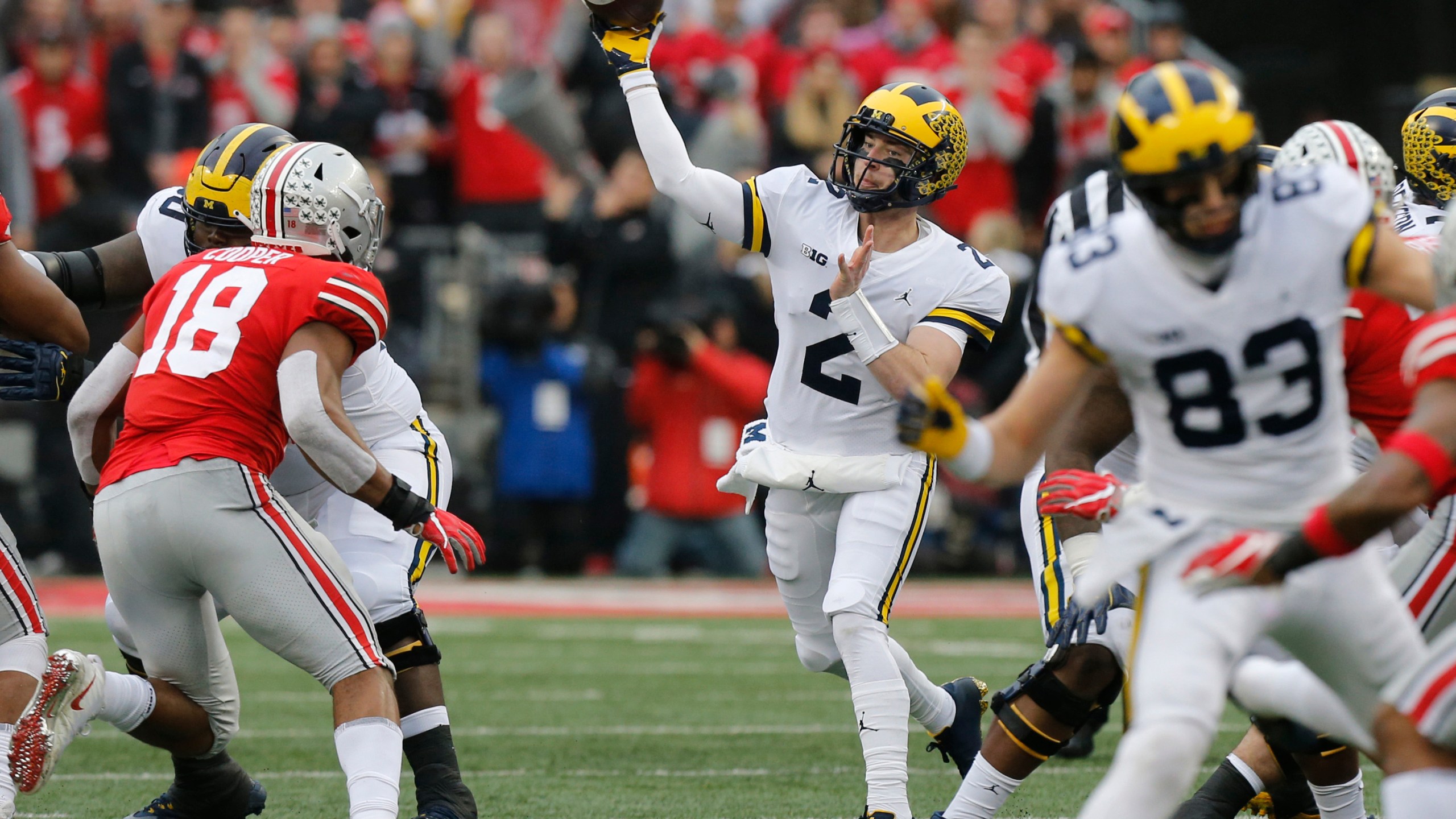 In this Nov. 24, 2018, file photo, Michigan quarterback Shea Patterson throws a pass against Ohio State during an NCAA college football game in Columbus, Ohio. Magistrate Judge Norah McCann King moved a change of plea hearing from June 18 to July 1, 2020, for Daniel Rippy. Rippy is accused of making an "electronic communication" threat from California during this game between Ohio State and the University of Michigan threatening a shooting and vowing to hurt players on the football team. (AP Photo/Jay LaPrete)