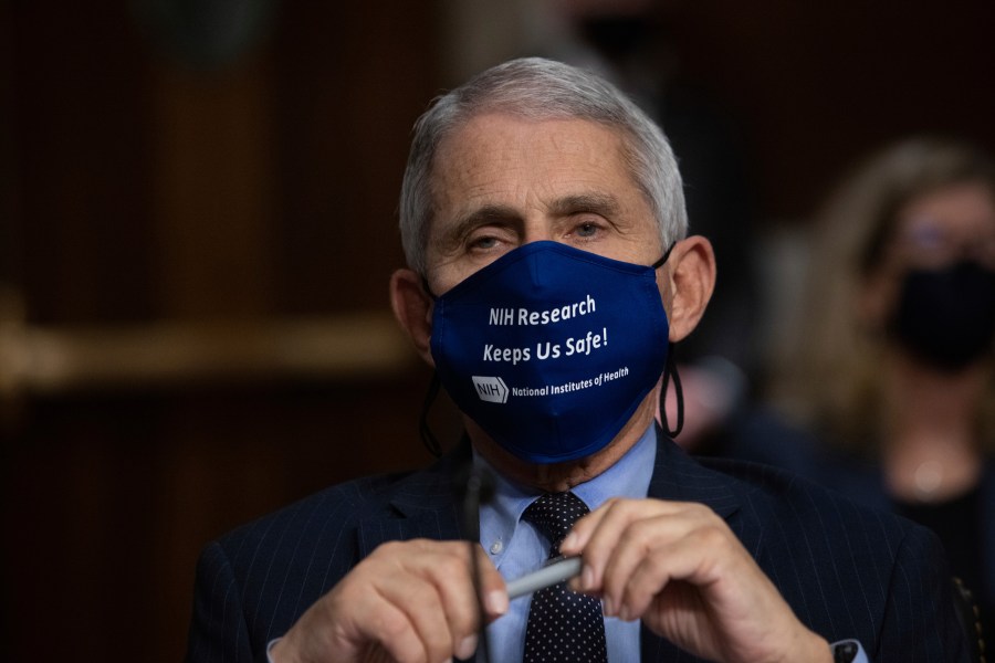 Dr. Anthony Fauci, Director of the National Institute of Allergy and Infectious Diseases at the National Institutes of Health, listens during a Senate Senate Health, Education, Labor, and Pensions Committee Hearing on the federal government response to COVID-19 Capitol Hill on Wednesday, Sept. 23, 2020, in Washington. (Graeme Jennings/Pool via AP)