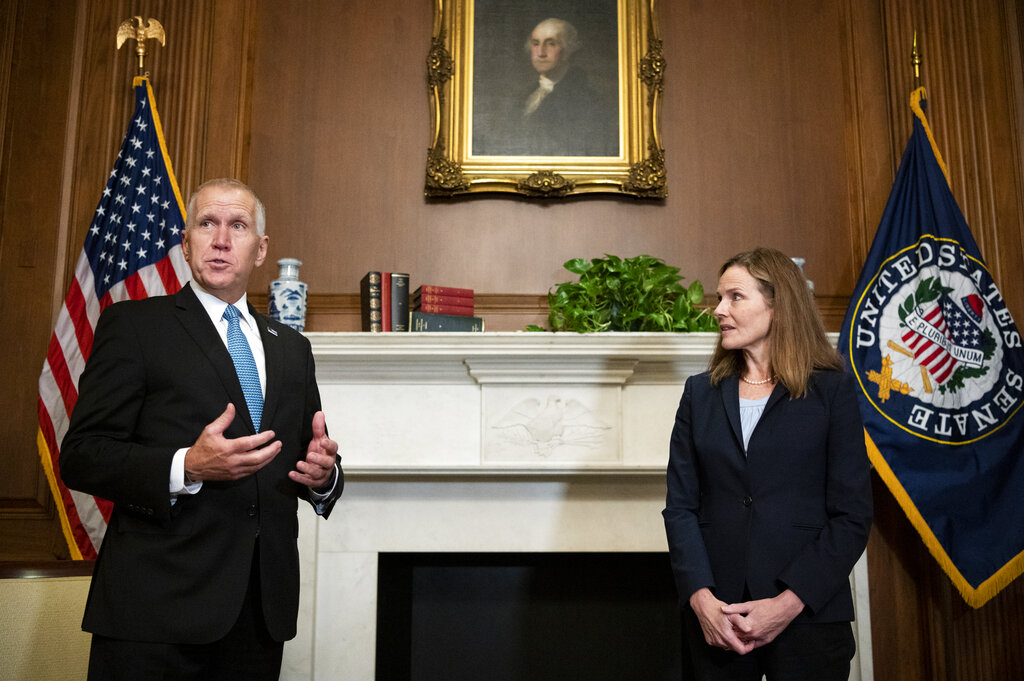 Sen. Thom Tillis, R-N.C., meets with Judge Amy Coney Barrett, President Donald Trump's nominee to the Supreme Court at the U.S. Capitol Wednesday, Sept. 30, 2020, in Washington. (Bill Clark/Pool via AP)