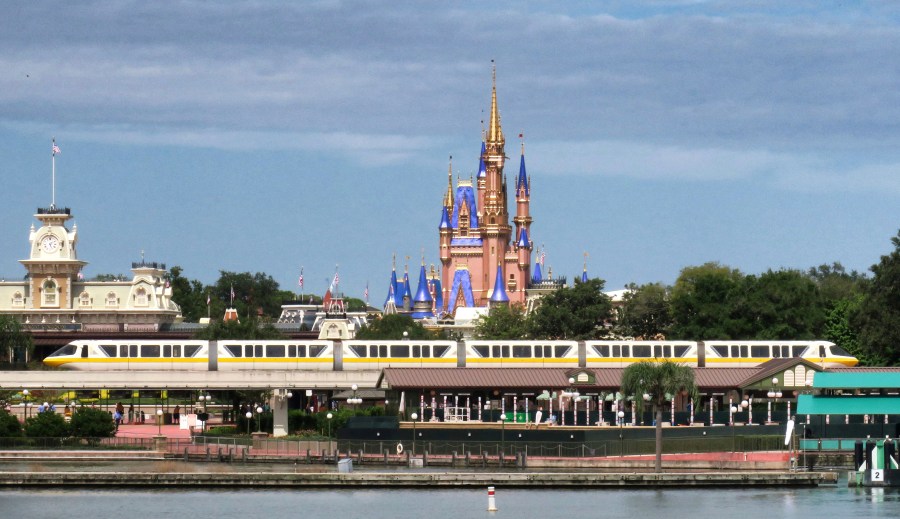 A view of Cinderella Castle from Seven Seas Lagoon in the Magic Kingdom at Walt Disney World, in Lake Buena Vista, Fla., Wednesday, Sept. 30, 2020. The Walt Disney Co. announced Tuesday that it is planning to lay off 28,000 workers in its theme parks division in California and Florida. The company has been squeezed by limits on attendance at its parks and other restrictions due to the pandemic. (Joe Burbank/Orlando Sentinel via AP)