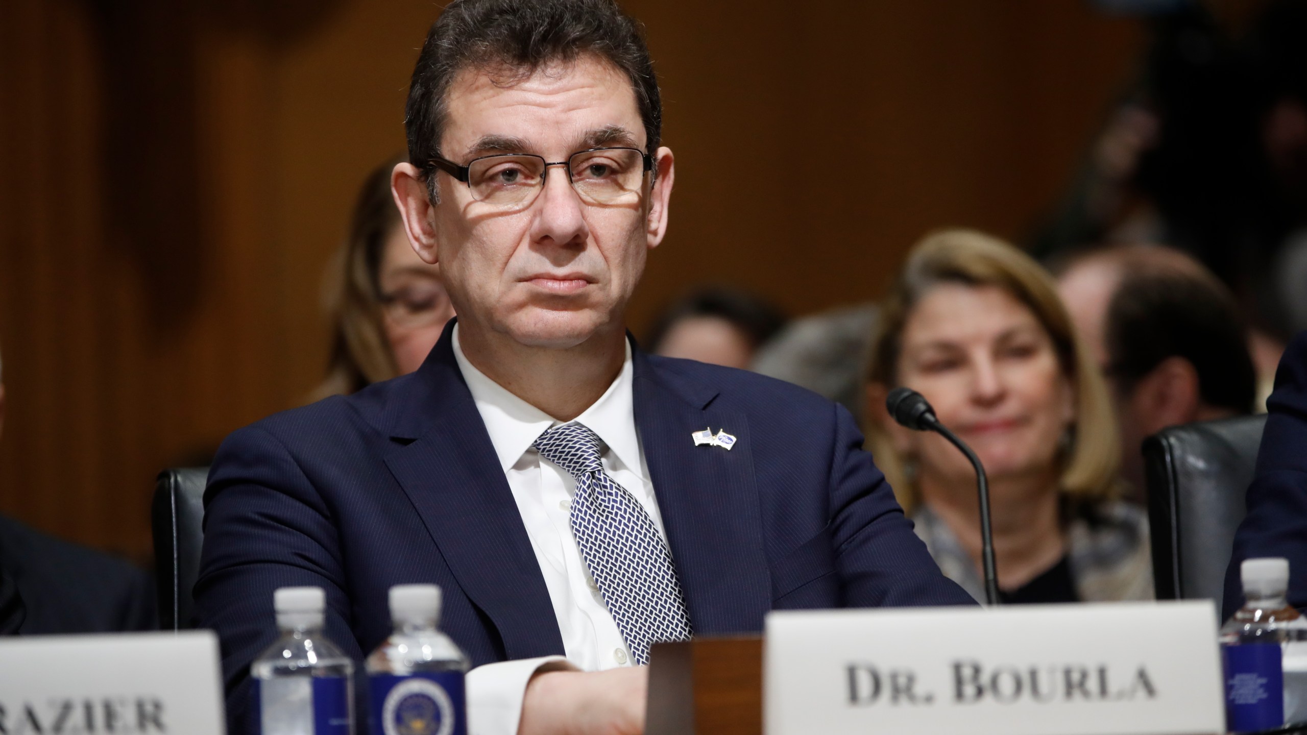 In this Tuesday, Feb. 26, 2019 file photo, Albert Bourla, chief executive officer of Pfizer, prepares to testify before the Senate Finance Committee hearing on drug prices, on Capitol Hill in Washington. On Thursday, Oct. 1, 2020, Bourla wrote to Pfizer employees that he's “disappointed” the timing for a vaccine to be available was politicized during Tuesday night’s presidential debate, saying the company won’t succumb to political pressure. (AP Photo/Pablo Martinez Monsivais)