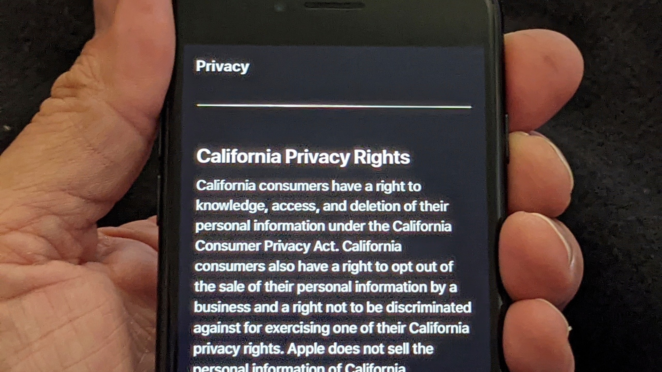 This photo illustration shows Apple's privacy policy on an iPhone in Los Angeles Friday, Oct. 2, 2020. (AP Photo/Damian Dovarganes)