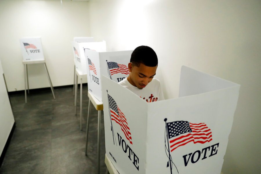 In this Oct. 23, 2018 file photo, Christian Goodman, 18, votes for the first time in his life at the Los Angeles County Registrar of Voters office Tuesday, Oct. 23, 2018, in Norwalk, Calif. (AP Photo/Marcio Jose Sanchez, File)