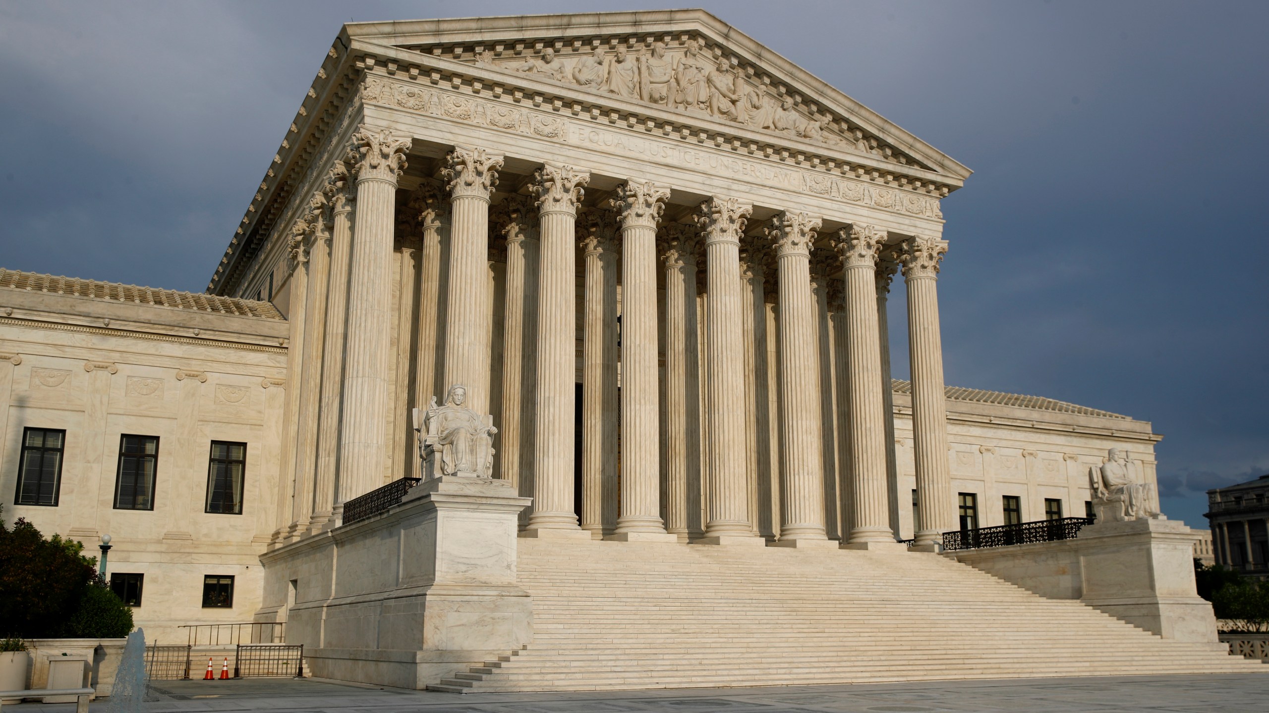 In this May 3, 2020, file photo the setting sun shines on the Supreme Court building on Capitol Hill in Washington. The Supreme Court opens a new term Monday, Oct. 5. (AP Photo/Patrick Semansky, File)