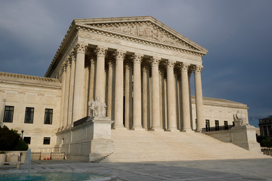 In this May 3, 2020, file photo the setting sun shines on the Supreme Court building on Capitol Hill in Washington. The Supreme Court opens a new term Monday, Oct. 5. (AP Photo/Patrick Semansky, File)