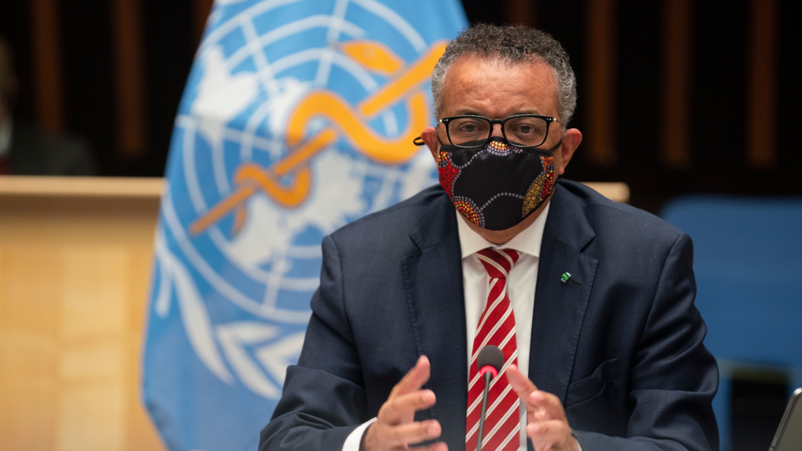 In this photo released by WHO, World Health Organization on Monday, Oct. 5, 2020, WHO Director-General, Dr Tedros Adhanom Ghebreyesus, wearing a mask to protect against coronavirus, gestures during a special session on the COVID-19 response. (Christopher Black/WHO via AP)