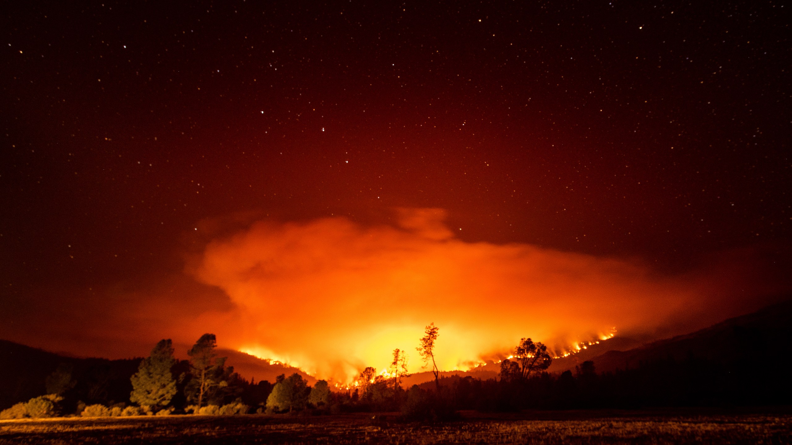 In this Sept. 16, 2020 file photo, the August Complex Fire burns near Lake Pillsbury in the Mendocino National Forest. (Noah Berger/Associated Press)