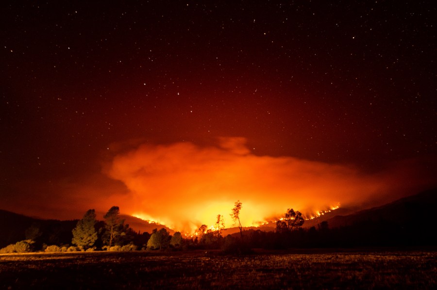 In this Sept. 16, 2020 file photo, the August Complex Fire burns near Lake Pillsbury in the Mendocino National Forest. (Noah Berger/Associated Press)