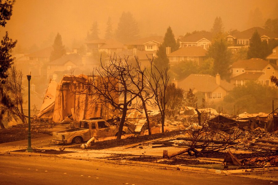 In this Sept. 28, 2020 file photo homes leveled by the Glass Fire line a street in the Skyhawk neighborhood of Santa Rosa, Calif. (AP Photo/Noah Berger, File)