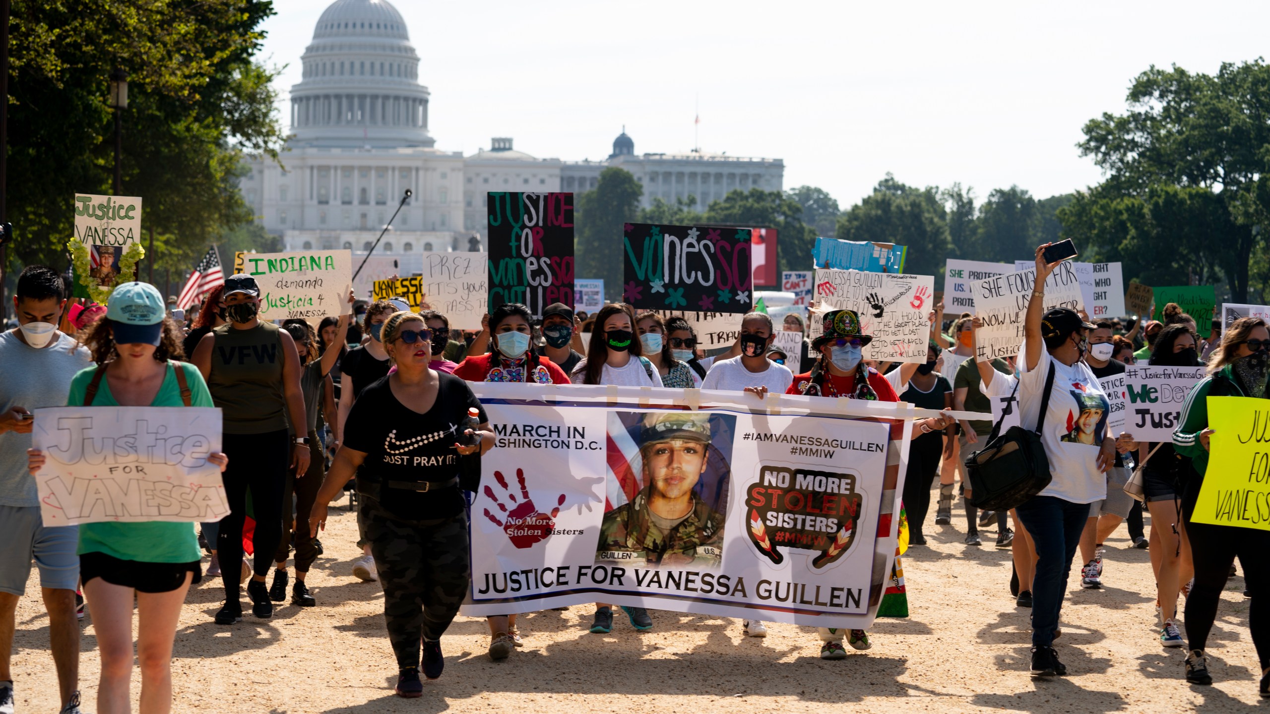 Supporters of the family of slain Army Spc. Vanessa Guillen march to the White House along the National Mall on July 30, 2020. (Carolyn Kaster / Associated Press)