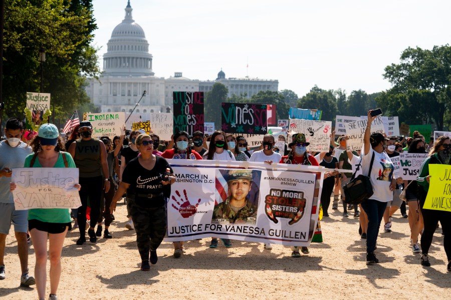 Supporters of the family of slain Army Spc. Vanessa Guillen march to the White House along the National Mall on July 30, 2020. (Carolyn Kaster / Associated Press)