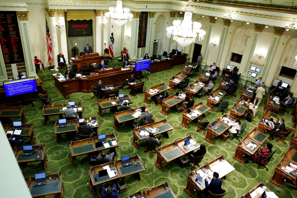 In this May 26, 2020, file photo, members of the state Assembly meet to discuss the state budget at the Capitol in Sacramento, Calif. (AP Photo/Rich Pedroncelli, Pool, File)