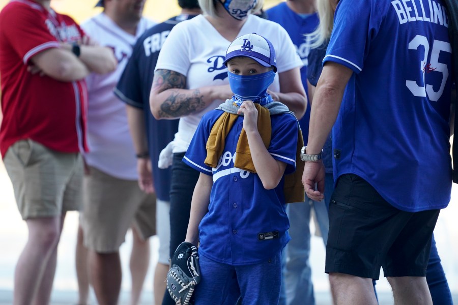 Fans arrive before Game 1 of a baseball National League Championship Series between the Los Angeles Dodgers and the Atlanta Braves on, Oct. 12, 2020, in Arlington, Texas. (AP Photo/Eric Gay)