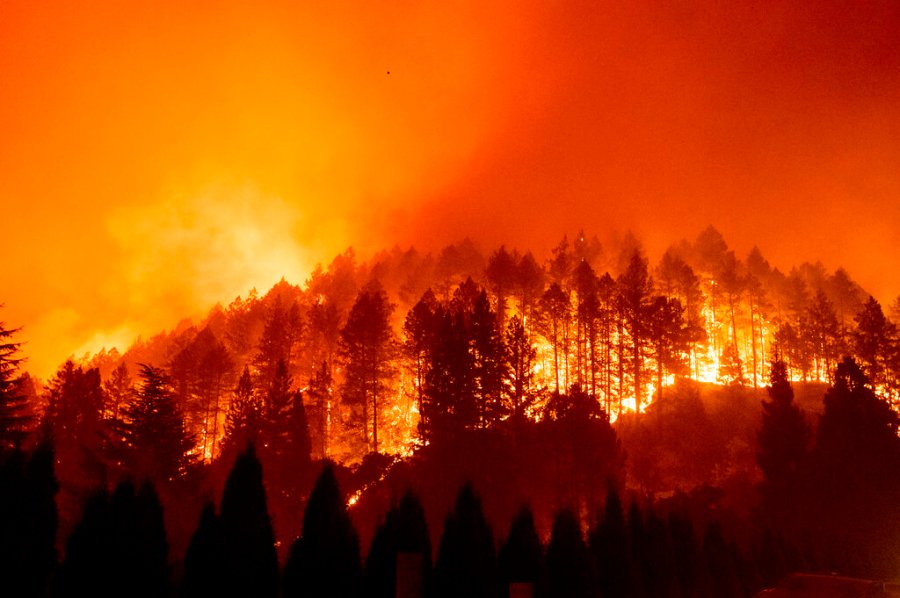 In this Sept. 27, 2020 file photo the Glass Fire burns a hillside above Silverado Trail in St. Helena, Calif. (AP Photo/Noah Berger, File)