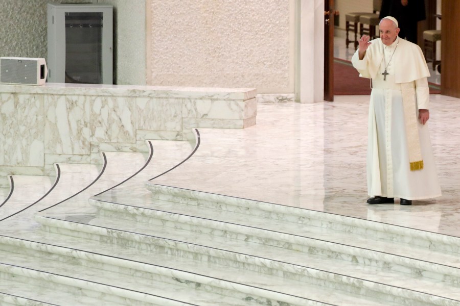 Pope Francis arrives for his weekly general audience in the Pope Paul VI hall at the Vatican, Wednesday, Oct. 14, 2020. (AP Photo/Andrew Medichini)